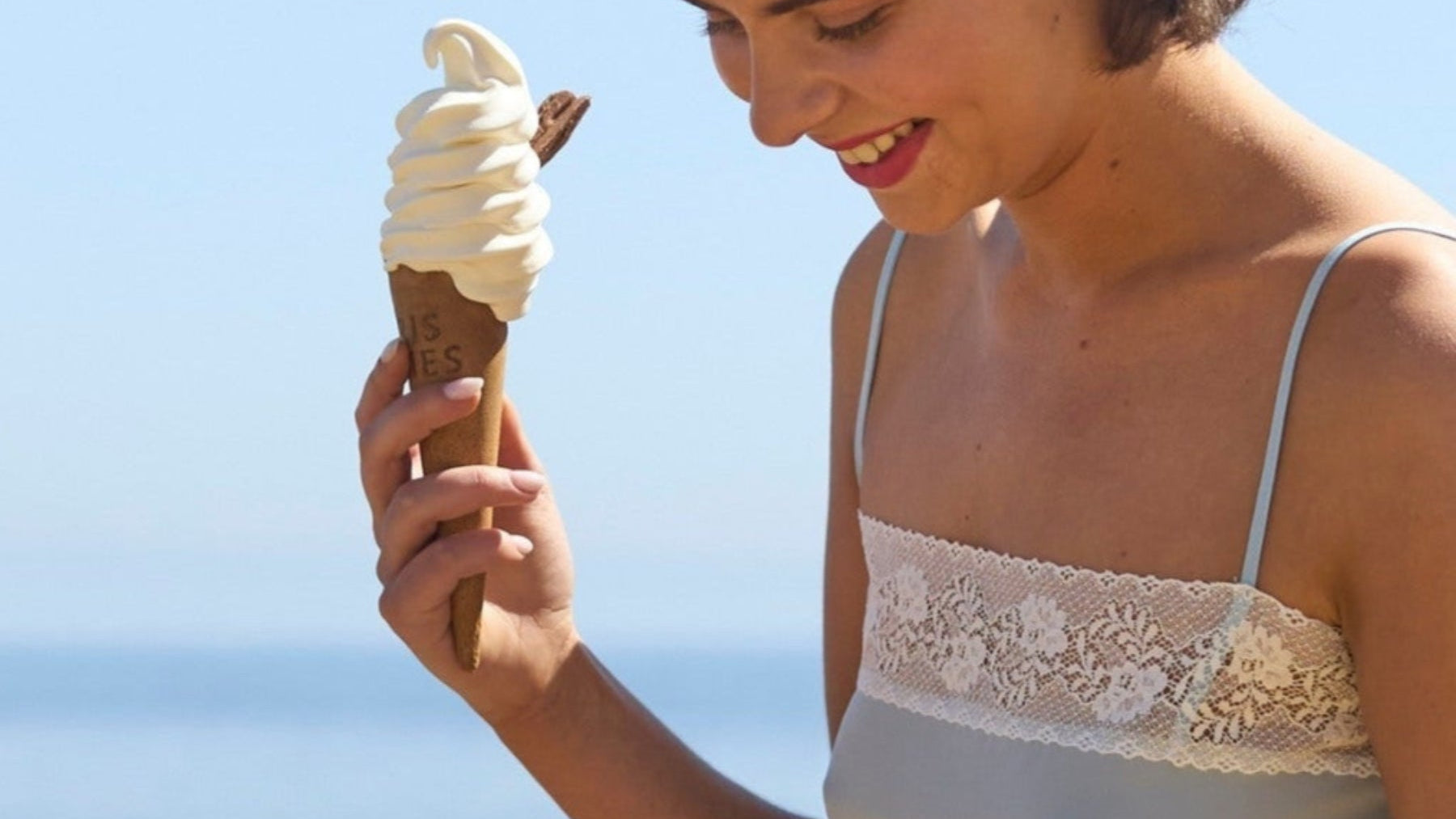 Daisy Tabak wearing silk crepe de chine camisole in pale blue with Cluny lace english made lace trim with Justine Tabak British made linen shorts