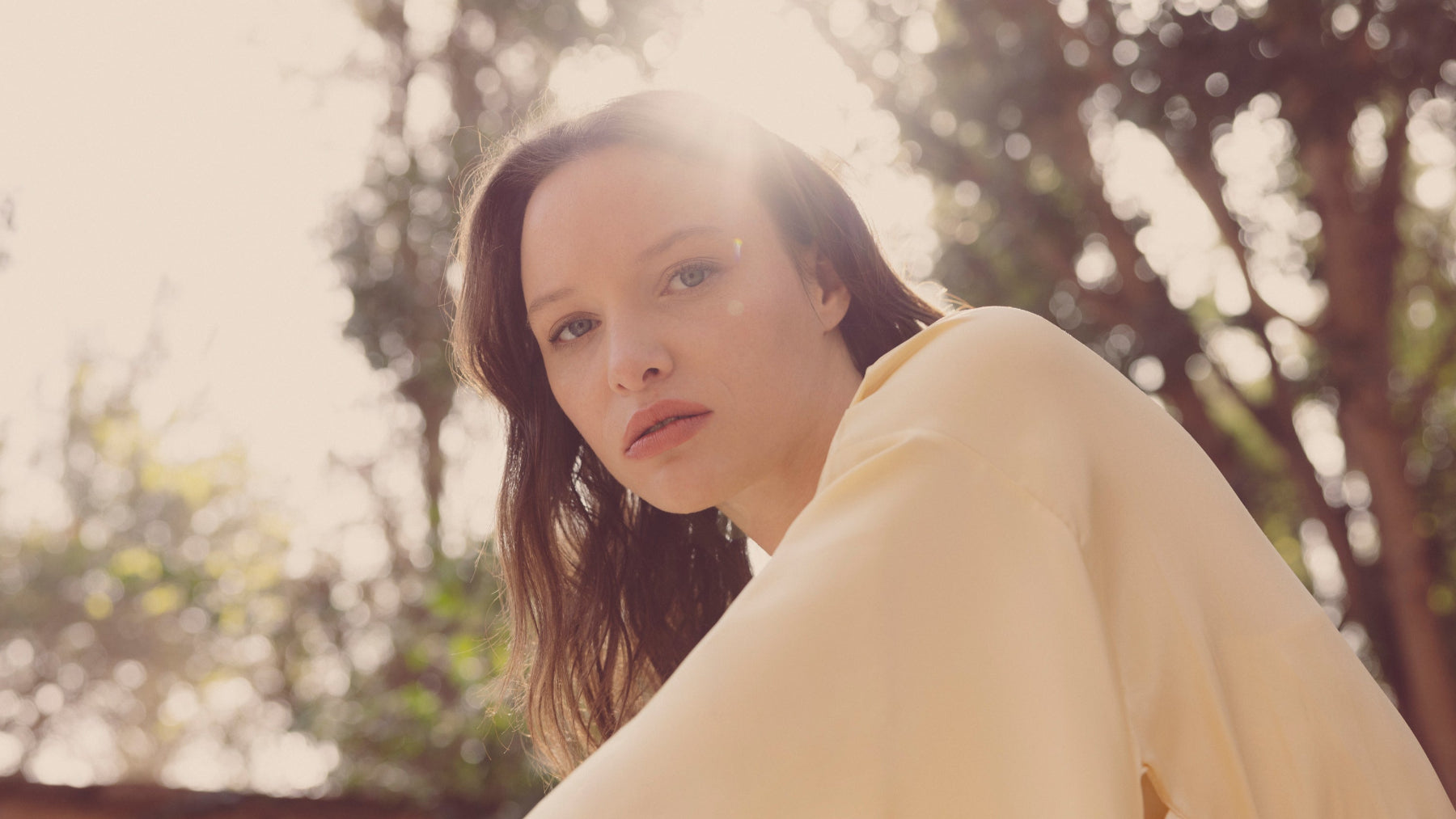 sunset hour model in butter yellow silk kimono in tropical moroccan loaction